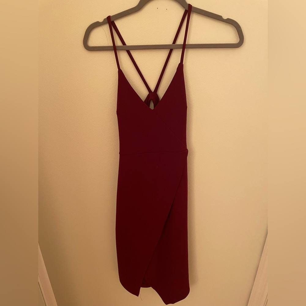 Red body con dress. Back cutout detail